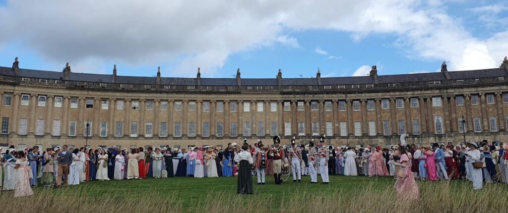 Crowd in Regency dress in front of the Royal Crescent, Bath